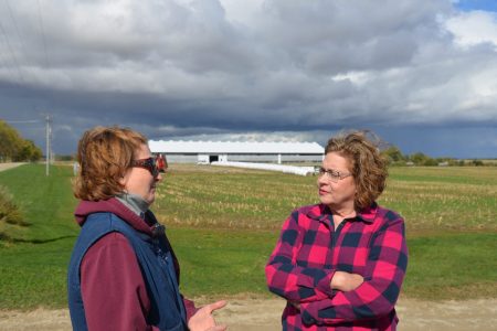 farm farmer talking to Carla